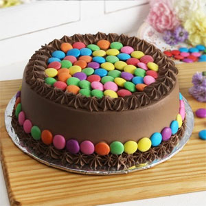 Chocolate Gems Cake 1kg  to Kakinada